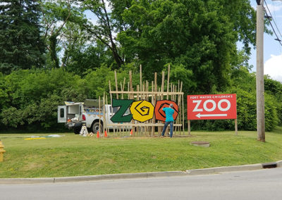Installation of Fort Wayne Children's Zoo Sign on Wells Street in Fort Wayne, IN