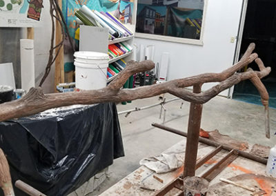 Stainless steel sculpted to look like wood for sea lion exhibit