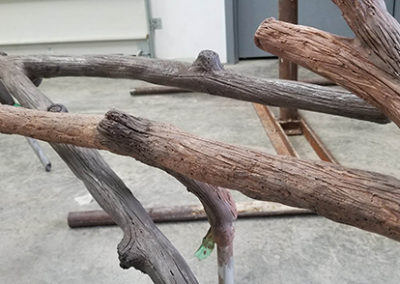 Stainless steel sculpted to look like wood for sea lion exhibit