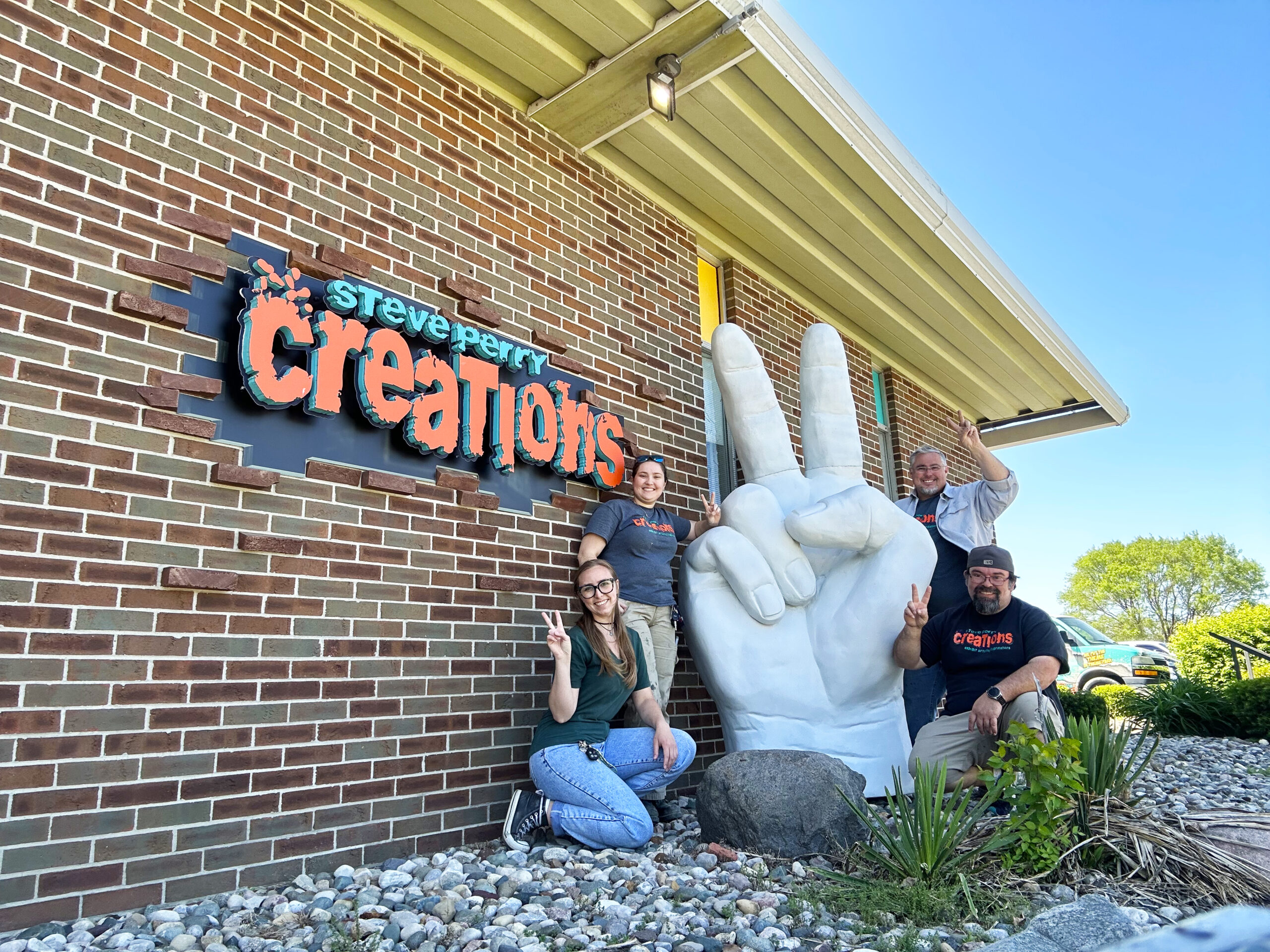 Steve Perry Creations Team with the Peace Hand made for the 2023 Hippie Fest